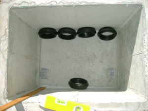 Concrete distribution box and Fernco flexible PVC
            fittings